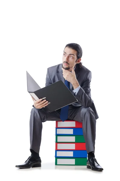Businessman with many folders on white — Stock Photo, Image