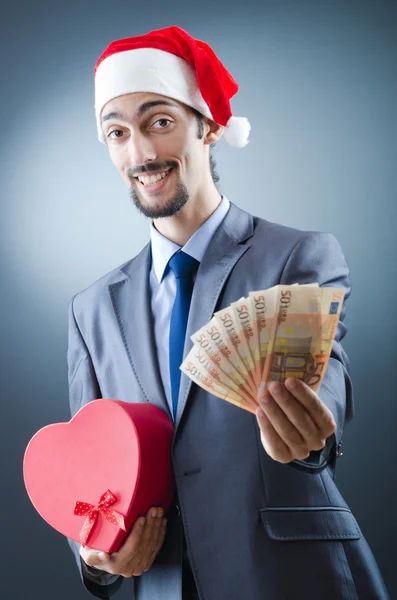 Weihnachtsmann mit Euro-Banknoten — Stockfoto