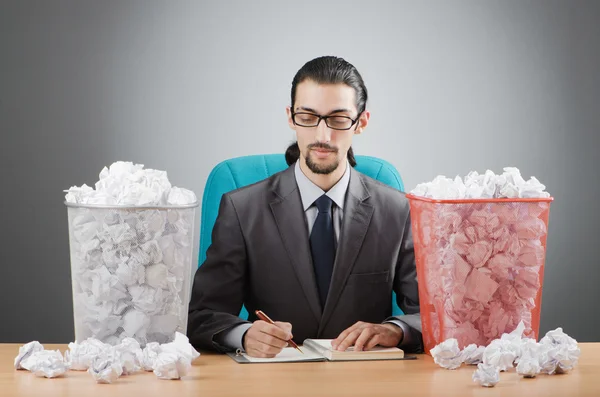Man with lots of wasted paper — Stock Photo, Image