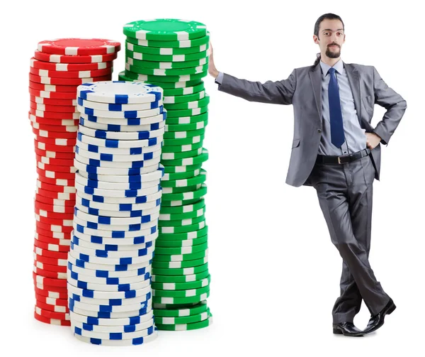 Geschäftsmann und Casino-Chips auf Weiß — Stockfoto