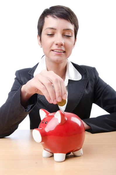 Woman and piggybank on white Stock Picture