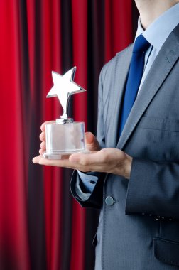 Businessman awarded with star award clipart