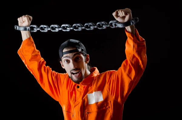 Inmate chained on black background — Stock Photo, Image