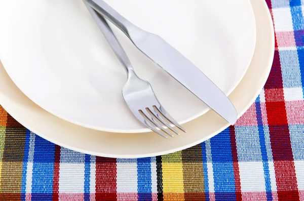 Empty plate with utensils — Stock Photo, Image