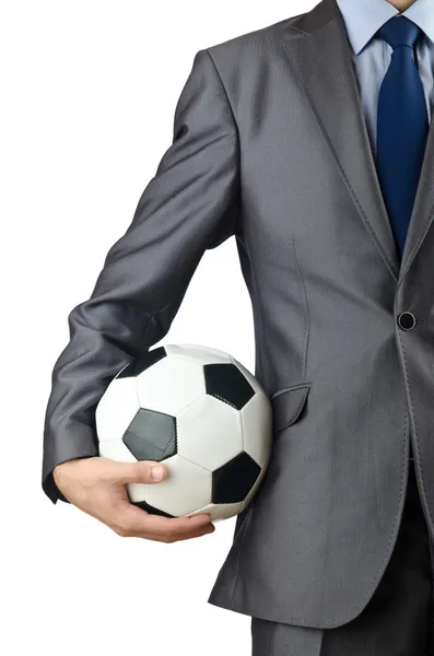 Бизнесмен держит футбол на белом — стоковое фото