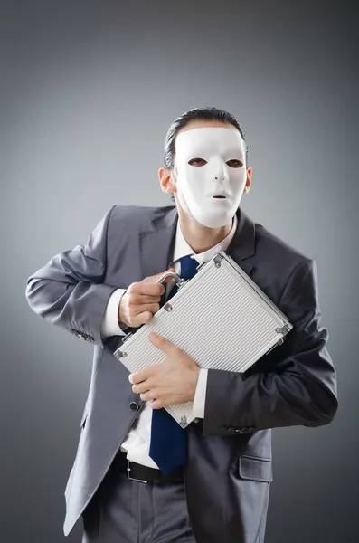 Industrial espionate concept with masked businessman Stock Picture