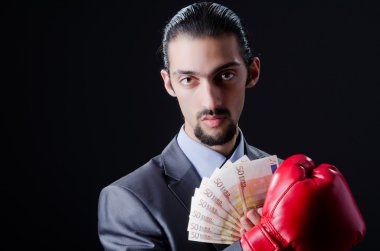 Man with boxing gloves and money clipart