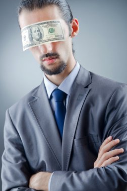 Businessman blinded with money clipart