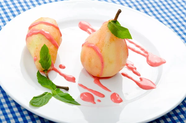 stock image Dessert with pear in sauce