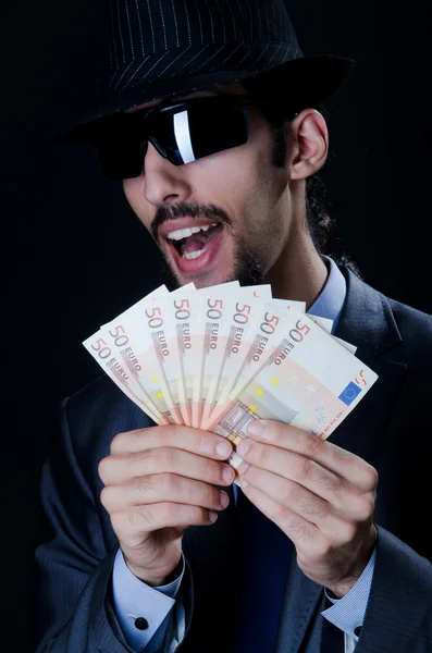 Άνθρωπος με counterfeir χρήματα — Φωτογραφία Αρχείου