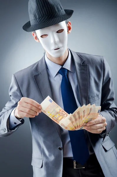 Uomo d'affari con denaro e maschera — Foto Stock