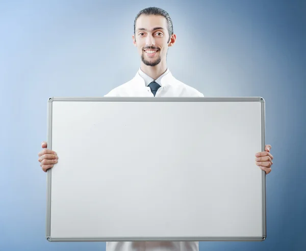Doutor com placa de mensagem em branco — Fotografia de Stock