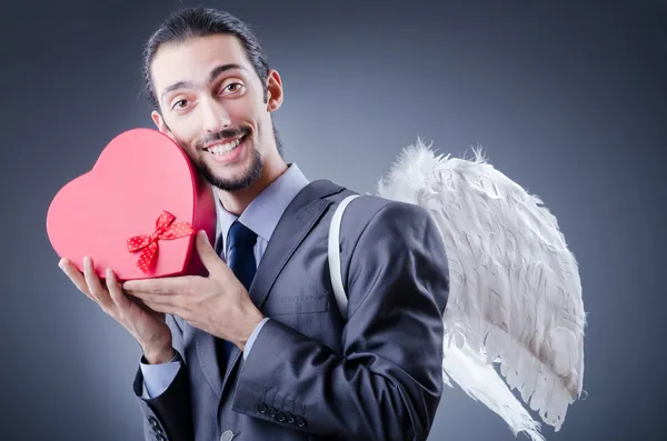 Man with wings and giftbox — Stock Photo, Image