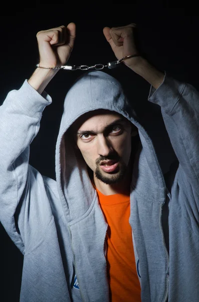 Young criminal with handcuffs — Stock Photo, Image