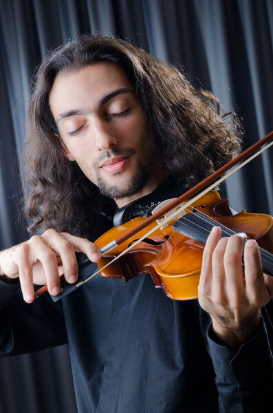 Young violin player playing