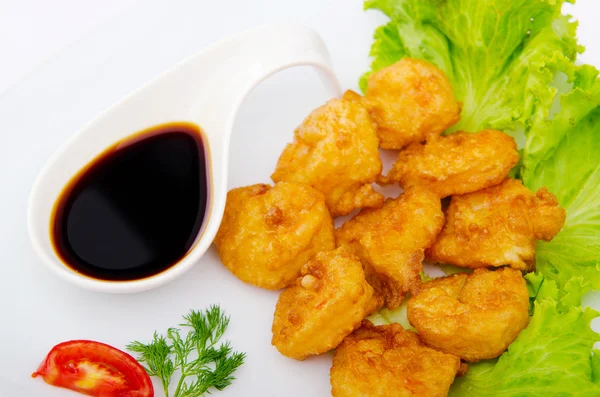 Breaded chicken pieces served with sauce — Stock Photo, Image