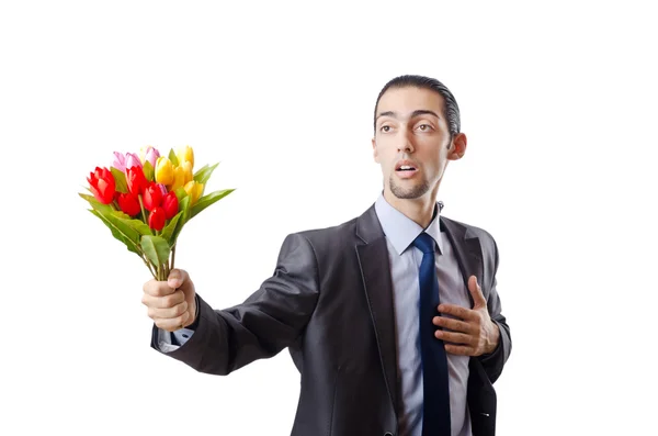 Jeune homme avec des fleurs de tulipes — Photo