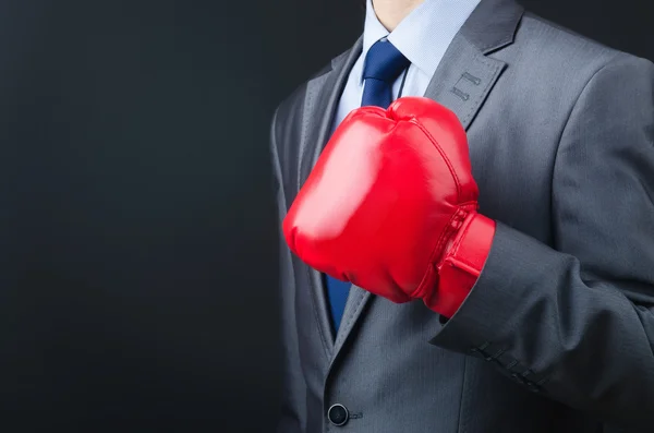 Young businessman with boxing gloves — Stock Photo, Image