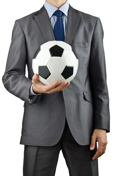 Бізнесмен тримає футбол на білому — стокове фото