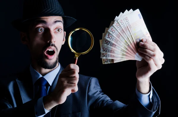 Man with counterfeir money — Stock Photo, Image