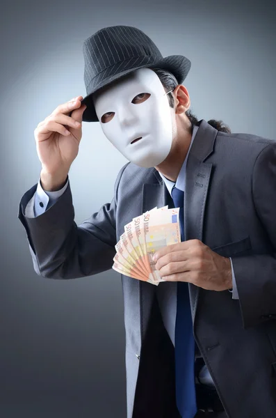 Homme d'affaires avec argent et masque — Photo