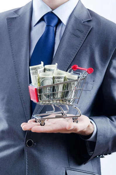 Einkaufswagen voller Geld — Stockfoto