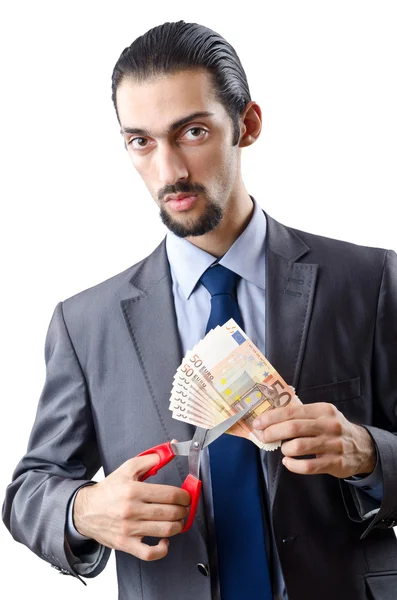Homme coupant de l'argent sur blanc — Photo