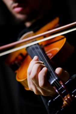 Young violin player playing clipart