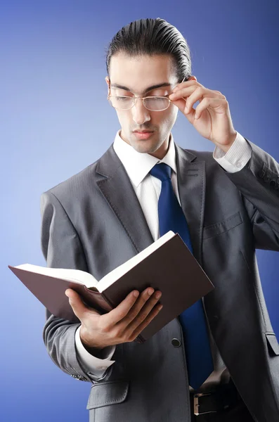 Businessman reading the book — Stock Photo, Image