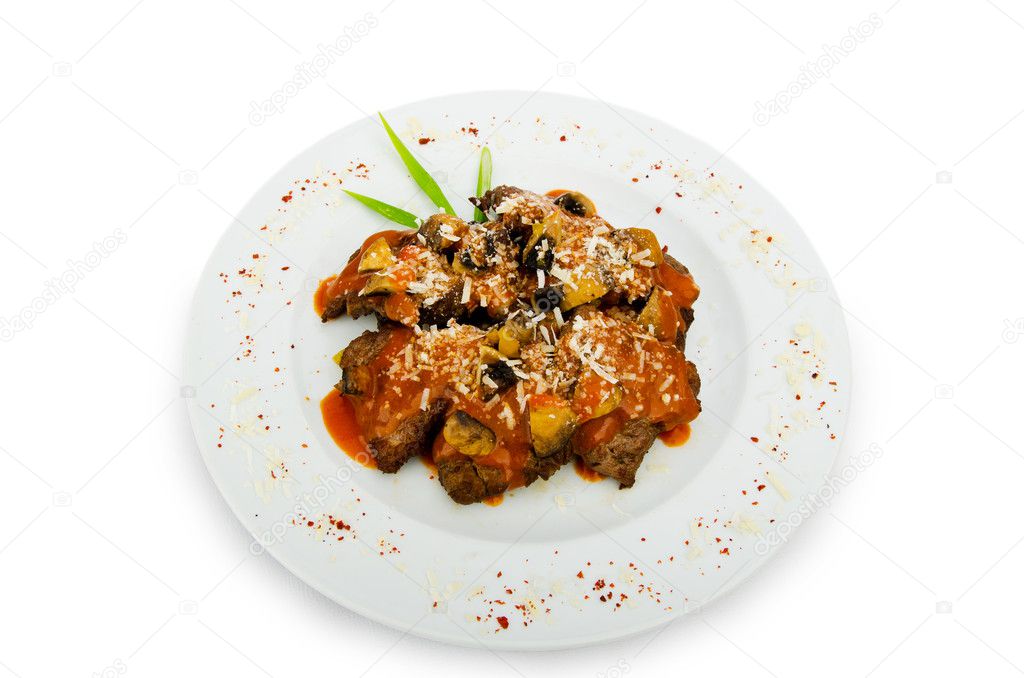 Meat under tasty sauce in plate