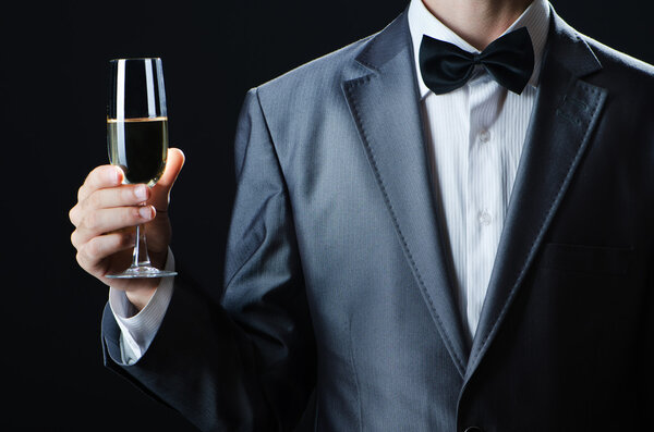 Man tasting wine in glass