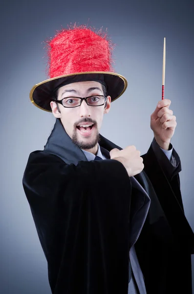 Magician in the business suit — Stock Photo, Image