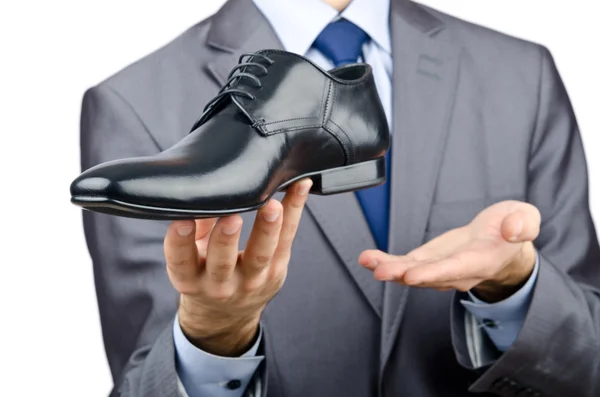 Muž s výběrem obuvi — Stock fotografie