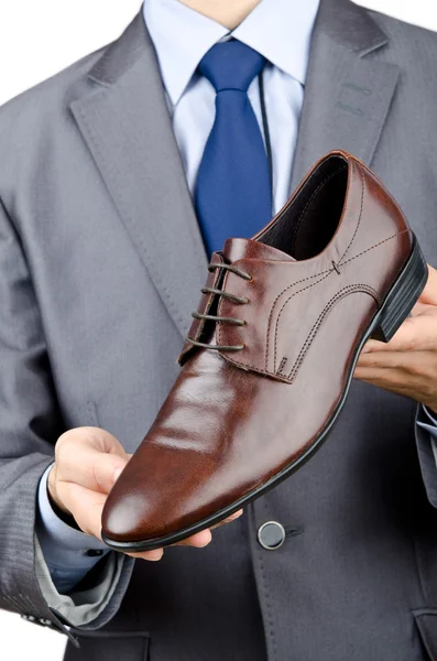 Homem com uma seleção de sapatos — Fotografia de Stock