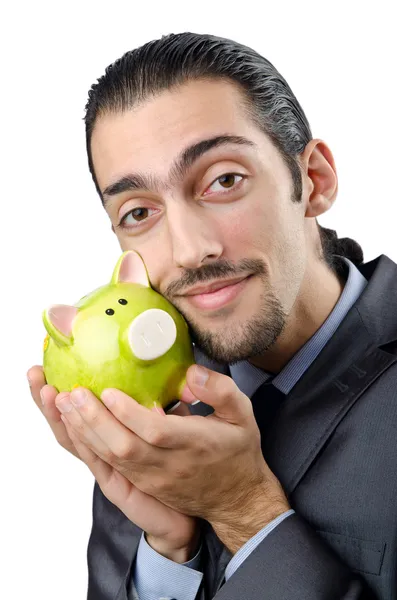 Mann spart sein Geld im Sparschwein — Stockfoto