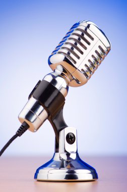 Vintage microphone against the background clipart