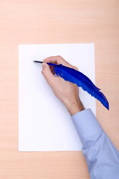 Man with quill writing — Stock Photo, Image