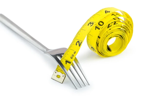 Dieting koncept med gaffel och mätare — Stockfoto