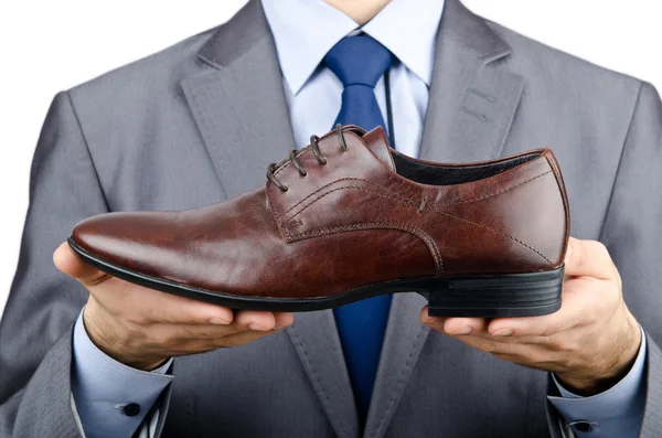 Man with a selection of shoes Royalty Free Stock Images