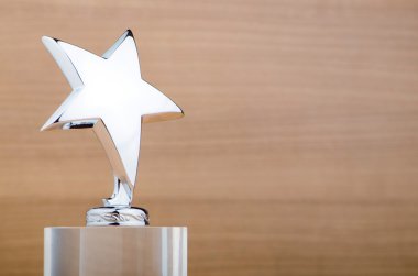 Star award against wooden background clipart