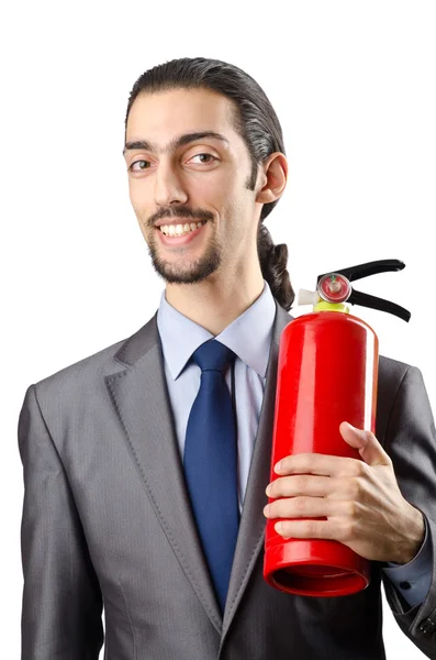 Людина з вогнегасником у концепції пожежогасіння — стокове фото