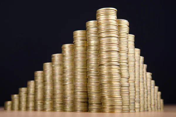 Golden coins in high stacks — Stock Photo, Image