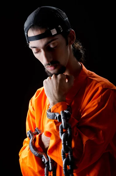 Inmate chained on black background — Stock Photo, Image
