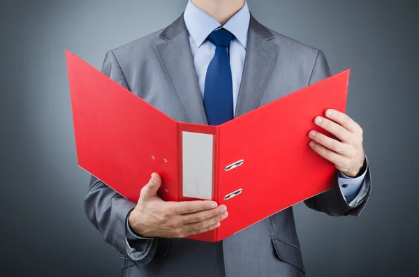 Young businessman with folders — Stock Photo, Image