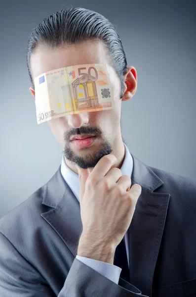 Businessman blinded with money — Stockfoto