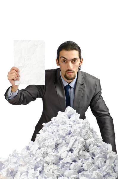 Muž se spoustou zmačkaný papír — Stock fotografie
