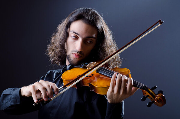 Young violin player playing