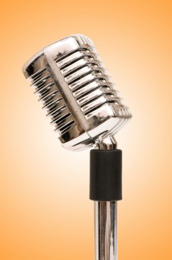 Vintage microphone isolated on the white background clipart