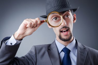 Detective and magnifying glass clipart