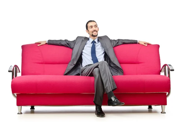 Hombre sentado en el sofá — Foto de Stock